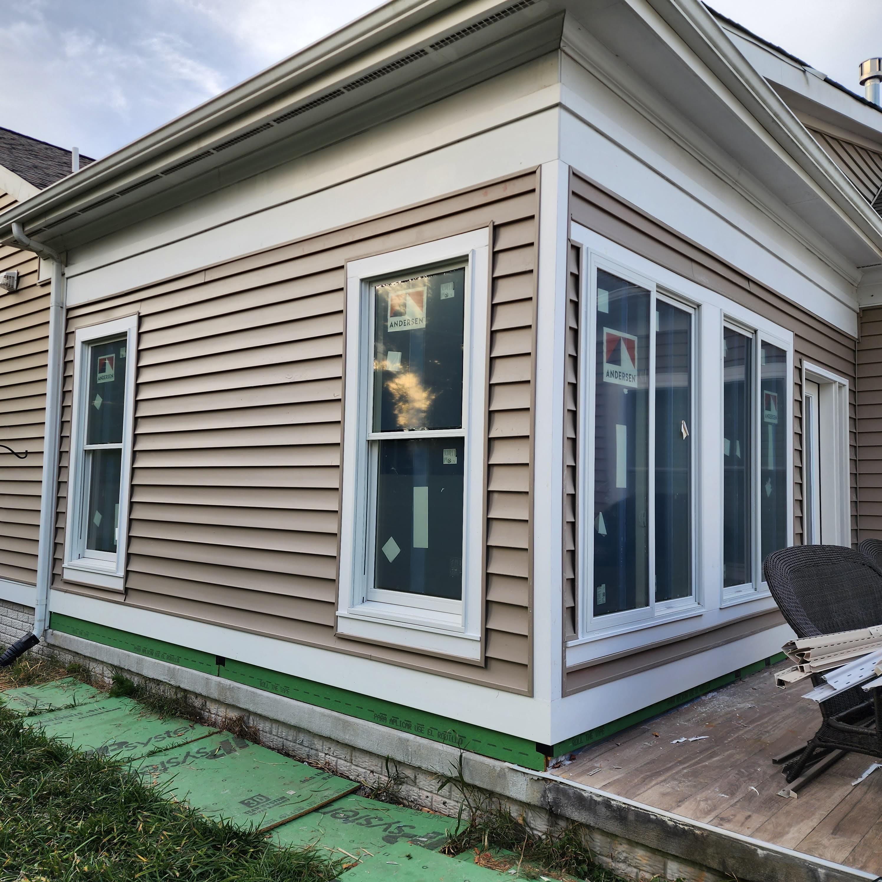 Home addition with new siding and Andersen windows
